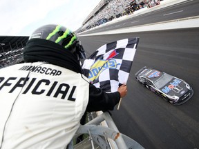 INDIANAPOLIS, INDIANA - SEPTEMBER 08: Kevin Harvick, driver of the #4 Mobil 1 Ford, crosses the finish line to win the Monster Energy NASCAR Cup Series Big Machine Vodka 400 at the Brickyard at Indianapolis Motor Speedway on September 08, 2019 in Indianapolis, Indiana. (Photo by Chris Graythen/Getty Images)