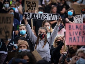 Protesters gather for a Black Lives Matter solidarity demonstration in Liverpool, U.K., on Tuesday in the wake of the death of an African-American man, George Floyd, while in the custody of Minneapolis police. A group in London, Ont., is organizing a similar rally for Saturday, prompting public health officials to recommend everyone who attends self-isolate for two weeks after. (Photo by Christopher Furlong/Getty Images)