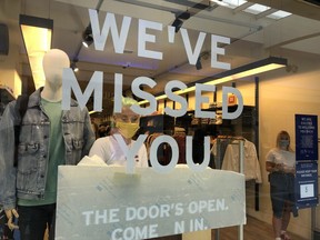 A shop in Churchill Square shopping mall welcomes its customers back on June 15, 2020 in Brighton, United Kingdom. The British government have relaxed coronavirus lockdown laws significantly from Monday June 15, allowing zoos, safari parks and non-essential shops to open to visitors.  Places of worship will allow individual prayers and protective facemasks become mandatory on London Transport.  (Photo by Mike Hewitt/Getty Images)