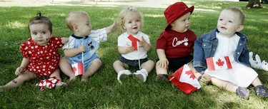 CANADA DAY 2006: Five young Canadians wait their turn to show off in front of the judging panel in "the lovable babies show," part of Canada Day celebrations at Pinafore Park in St. Thomas. From left are Bailey Bishop-Hume, Alex Duncan, Taija Marritt, Logan Savage and Chelsea Dennis. (Dave Chidley/The London Free Press)