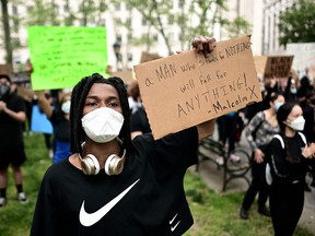 Tyqaun White, 20, a black musical theory major at Point Park University, poses for a portrait on June 2, 2020, during a "Black Lives Matter" protest at Washington Square Park in New York City. White says he's protesting "because it's just too much, it's gotten to a point where black people are just asking not to be killed". "It's just got to stop", he said.  A week of protests over the death of George Floyd, a black man, at the hands of a police officer in Minneapolis has rocked the United States. (Photo by Johannes EISELE / AFP)