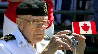 CANADA DAY 2008: Bill Rohrer, 80, was but a boy when he served in the Canadian army in the latter years of the Second World War. He celebrated Canada Day at the Beaumont Hamel Parade held at Wolseley Barracks by showing he can still take a good shot, but now with a camera. (Ken Wightman/The London Free Press)
