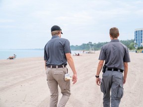 At least four bylaw officers were on Grand Bend beach enforcing rules. Officers couldn’t comment for the story, but were seen telling a woman that dogs aren’t allowed on the beach. (MAX MARTIN, The London Free Press)