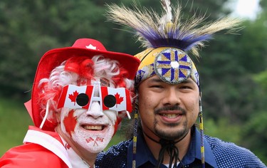 CANADA DAY 2013: Greg Sturm (left) poses with native dancer Barry Albert during a Canada Day celebration in London. (Dave Chidley/Canadian Press)