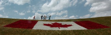 CANADA DAY 2005: A large flag painted on the hill at White Oaks Park was part of the Canada Day 2005 family celebration in south London. Sue Reeve/The London Free Press