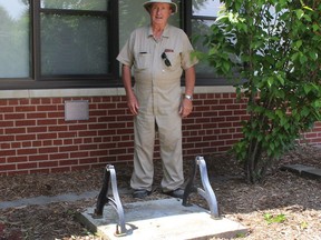 Frank Letourneau stands near the base where the former SS #4 Dover school bell was recently stolen from in front of the Pain Court high school. (Ellwood Shreve/Chatham Daily News)