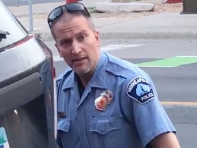 In this file still image taken on May 25, 2020, from a video courtesy of Darnella Frazier via Facebook, shows Minneapolis police officer Derek Chauvin during the arrest of George Floyd.