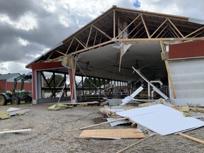 The Pettit family's dairy barn southeast of Belmont was damaged when a tornado tore through the area Wednesday evening. No injuries to cattle or people were reported. (MIKE HENSEN, The London Free Press)