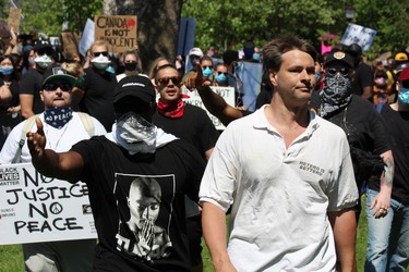 Demonstrators ejected a man whose shirt read 'hetero is bettero' from the Black Lives Matter rally in London on Saturday, June 6, 2020, after a scuffle broke out. London police officers spoke with the man briefly before he was seen walking away. DALE CARRUTHERS / THE LONDON FREE PRESS