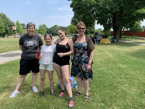 Old East Villagers stepped up with donations to help the homeless who have moved into the urban camp at Queens Park, next to Western Fair. Deb Braniff (far left) and Jennifer King (far right) collected food, clothing and personal hygiene products for the campers. Both Pam Norris (centre left) and Hailey Grigg (centre right) are living in the park. (Jane Sims/The London Free Press)