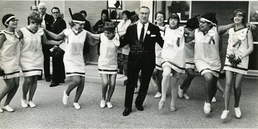 Jim Lind, Liberal candidate in Middlesex, locks arms with the True Pets, composed of girls from Kettle Point Indian reserve and Forest, 1968. (London Free Press files)