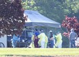 Health-care staff test migrant workers at ScotLynn Group in Norfolk County for COVID-19 in June. (Derek Ruttan/The London Free Press)