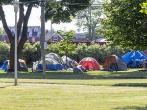 A tent city has emerged at Queens Park beside the Western Fair Raceway. (Derek Ruttan/The London Free Press)