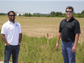 Kapil Lakhotia, president of the LEDC, (left) and Mark Henderson, director of industrial land development strategy with city hall, at the future site of ANVO Pharma on Bonder Road in London, Ont. on Wednesday June 17, 2020. Derek Ruttan/The London Free Press/Postmedia Network