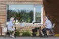 Betty Morris visits with her husband Victor outside of the McCormick Home where Victor resides in London, Ont. on Thursday June 18, 2020. Derek Ruttan/The London Free Press/Postmedia Network