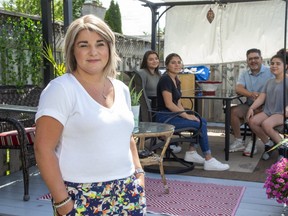 Lori Martinez, a Home and School Association member, says the London-area public school board has done well so far into the COVID-19 pandemic, but that many questions remain unanswered for parents by Ontario's directive that schools prepare for several back-to-school scenarios in the fall aimed at keeping the virus at bay. Martinez is shown with her three daughters and husband, left to right, Abby, Genevieve, Luis and Antonia. (Derek Ruttan/The London Free Press)