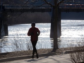 Colm Kelly of London gets in his 14km run along the quiet multi-use pathways past the defunct Springbank Dam in London, Ont. on Wednesday April 15, 2020. (Mike Hensen/The London Free Press)