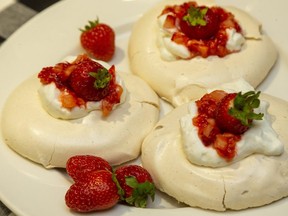 Strawberry pavlovas, teaming crisp meringue, rich whipped cream and fresh local fruit, are a great way to mark Father's Day this weekend, Jill Wilcox says. (Mike Hensen/The London Free Press)