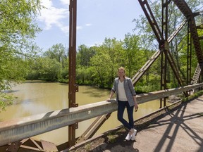 Elizabeth VanHooren, Kettle Creek Conservation Authority general manager, shows one of the bridges beneath which a new water trail will pass in the Dalewood conservation area near St. Thomas on Tuesday, June 2, 2020. (Mike Hensen/The London Free Press)