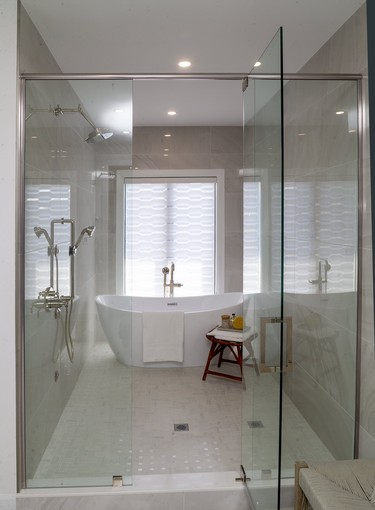 A large "wet" room featuring a walk in shower and a stand alone tub in the ensuite of London's new Dream Lottery home south off of Pack Road near Lambeth. The home was built by David Reis of Reis Design Build and the designer is Angela Bobanovic. Photograph taken on Friday June 5, 2020. (Mike Hensen/The London Free Press)