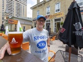 Mark Serre, the owner of the Morrissey House on Dundas Street in London, Ont. spent Wednesday organizing the patio to keep patrons two metres apart. Local restaurants will be able to serve guests on their patios in the city starting Friday. (Mike Hensen/The London Free Press)