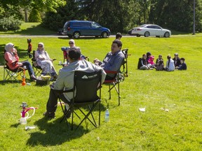 A three family get together in Springbank Park shows that the COVID-19 restrictions are lessoning in London, Ont.  Photograph taken on Sunday June 14, 2020.  Mike Hensen/The London Free Press/Postmedia Network