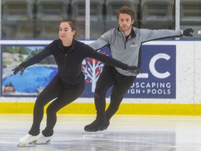 Evelyn Walsh, 18 of London, and Trennt Michaud, 23, Canada's No. 2-ranked senior pairs figure skaters, warm up at the Komoka Wellness and Recreation Centre, their temporary training base amid the COVID-19 pandemic. (Mike Hensen/The London Free Press file photo)