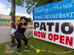 Tammy Kourtesis, owner of Country Hearth Family Restaurant in Komoka, is  happy Wednesday, June 24, 2020  that she's been able to get a patio up and running in the small village west of London, Ont.  Kourtesis says, "The patio? It keeps us alive, keeps our staff going, we see customers again, lots of regulars coming back." Kourtesis says patios are essential now to keep restaurants from going under.  (Mike Hensen/The London Free Press)