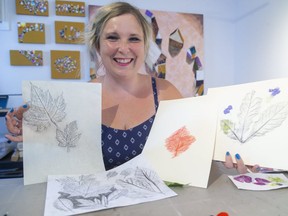 London artist Jen Hamilton shows some of the leaf prints she's made from rubbing a pencil over tree leaves. The craft will be part of Canada Day online programming  in London. (Mike Hensen/The London Free Press)