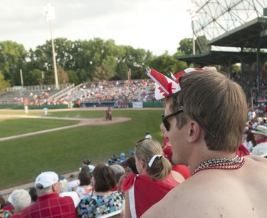 CANADA DAY, 2012: Nathan Coutts sports a pair of Canadian flags on his sunglasses while taking in a London Majors game on Canada Day at Labatt Memorial Park in London on Sunday July 1, 2012. CRAIG GLOVER The London Free Press