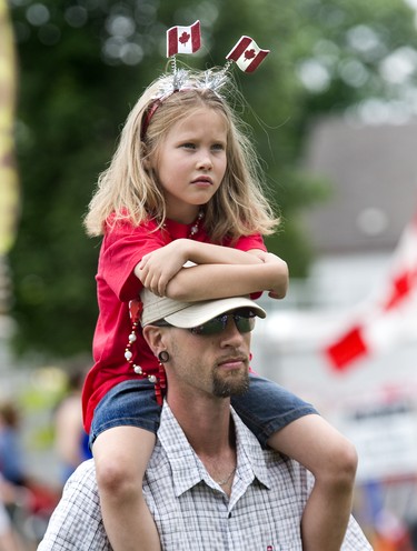 CANADA DAY 2014: Joseph and Elizabeth Cottle watch a citizenship ceremony at Harris Park during Canada Day celebrations  in London, Ontario on Tuesday, July 1, 2014. DEREK RUTTAN/ The London Free Press