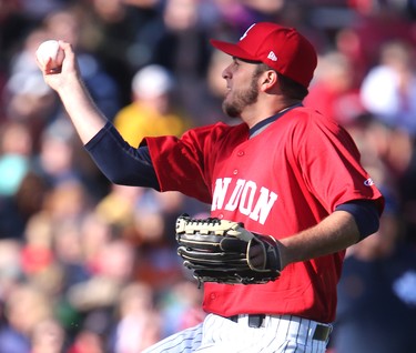 CANADA DAY 2016: London Majors pitcher Elis Jimenez fields a high bouncer one handed and throws out Toronto's Grant Tamane in the first inning of their Canada Day game against the Toronto Maple Leafs in Labatt Park in London on Friday July 1, 2016.  The Majors were wearing brand new red uniforms for the game. Mike Hensen/The London Free Press