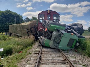 A London man faces a Highway Traffic Act charge after a farm tractor, towing a hay wagon, and an Ontario Southern Railway train collided at a South-West Oxford level crossing Tuesday, Oxford OPP say. (Supplied)