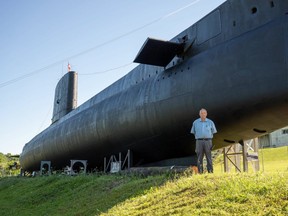 Ian Raven, executive director of the Elgin Military Museum, stands in front of the newly painted HMCS Ojibwa in Port Burwell. Retired submariners, veterans and members of Team Rubicon, the Canadian Heroes Foundation, Eastern Ontario, and the Canadian Forces volunteered to help repaint the vessel for its reopening with volunteers travelling from Ottawa, Kingston, Coburg, Oshawa, Peterborough, Hamilton, London, Port Dover and Niagara. (Max Martin/The London Free Press)