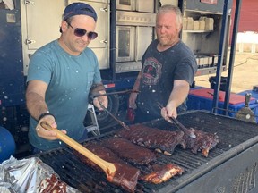 Tom Diavolitsis, left, and Chad Cannon, co-owners of the award-winning Boss Hog’s BBQ, have set up at Cowboy's Ranch on Wharncliffe Road North at Riverside Drive along with a few other vendors who were shut down this summer when London Ribfest and Craft Beer Festival and several other festivals at Victoria Park were cancelled due to the pandemic.