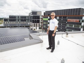 Richard Sifton, president and CEO of Sifton Properties on the roof of the company's head office in the West 5 neighbourhood the company constructed in London. (Derek Ruttan/The London Free Press)