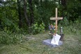 A memorial has been placed at the location where police removed suspected human remains in a wooded area off Jaqueline Street near Ada Street in London, Ont. (Derek Ruttan/The London Free Press)