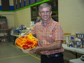 James Coolidge, executive director of the Youth For Christ Ministry in London displays peppers donated by Harvest Hands on Thursday, July 30, 2020. The organization hands out 140 meals a night to those in need. (Derek Ruttan/The London Free Press)