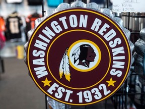 Washington Redskins merchandise is seen for sale at a sports store in Fairfax, Virginia on July 13, 2020. - The Washington Redskins confirmed on July 13 that the team is changing its name following pressure from sponsors over a word widely criticized as a racist slur against Native Americans. (Photo by ANDREW CABALLERO-REYNOLDS / AFP)