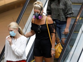 People walk through the Rideau Centre in Ottawa, as efforts continue to help slow the spread of COVID-19 on July 13, 2020. (REUTERS/Blair Gable)