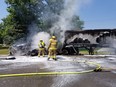 Provincial pol;ice released this image of firefighters dousing the aftermath of a serious two-vehicle crash that closed a stretch of Highbury Avenue between Eight Mile and Nine Mile roads, north of London, Wednesday. (Supplied)