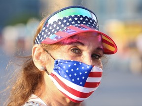 A woman wears a patriotic mask in celebration of the fourth of July at Gantry Plaza State Park in Long Island City, New York, U.S., July 4, 2020.
