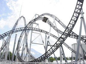 People react as they ride on Fuji-Q Highland amusement park world's steepest roller coaster "Takabisha" with a free falling angle of 121 degrees, at a press preview at Fujiyoshida city in Yamanashi prefecture on July 8, 2011. (YOSHIKAZU TSUNO/AFP/Getty Images)
