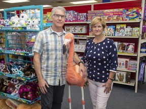 Scholar's Choice co-owners Scott and Cindy Webster — in their Trafalgar Street store in London, Ont. on Monday July 13, 2020 — are seeking creditor protection as they plan to   close all but three of their stores as the firm, hard-hit by the pandemic, shifts to online and catalogue sales of educational toys, teaching materials and furniture. (Derek Ruttan/The London Free Press)