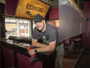 Richmond Tavern general manager Mark Dencev has installed plexiglass panels in front of the bar's stage. Photo shot in London, Ont. on Wednesday July 15, 2020. The Richmond will open again at 12:01 am Friday. (Derek Ruttan/The London Free Press)