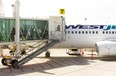 Passengers use a jetway to disembark from a WestJet 737 at London International Airport on Friday May 17, 2019. (Free Press file photo)