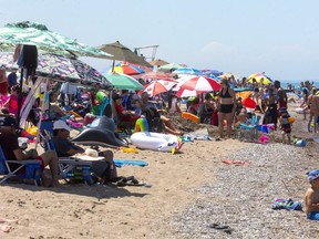 The Grand Bend beach was crowded on Canada Day, with lifeguards estimated 6,000 to 7,000 people were there. (Mike Hensen, London Free Press)