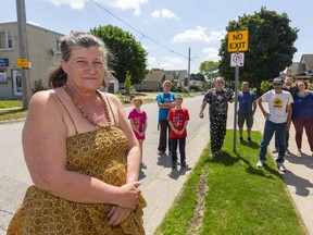 Lorraine Low and other residents of Arundell Street, are frustrated by the amount of traffic heading down their dead-end street in an attempt to avoid the construction at Hamilton Road and Egerton Street in London. They say city signage needs to be adjusted, but the city won't do the job during the pandemic. (Mike Hensen/The London Free Press)