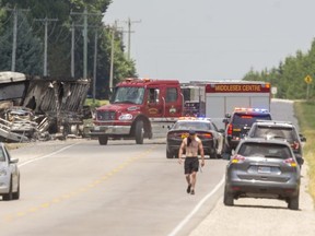 The driver of an SUV was killed and the driver of a transport truck seriously injured in a fiery crash Wednesday on Highbury Avenue north of 8 Mile Road. There were no passengers in either vehicle. The transport caught fire after the collision. (MIKE HENSEN, The London Free Press)