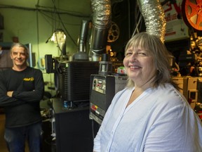 Hyland Cinema co-owner Moira Adlan says she still has to arrange staffing and order films for projectionist Victor Liorentas, left, to show, but the Wharncliffe Road independent theatre aims to reopen for indoor screenings by July 24 after the province announced it was further easing COVID-19 restrictions effective Friday, July 17.  (Mike Hensen/ The London Free Press)